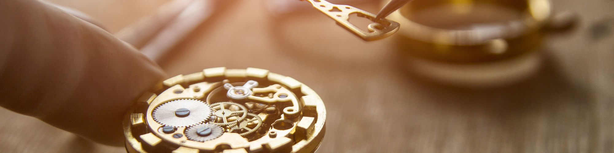 Close up of a pocket watch being repaired by a professional jeweler